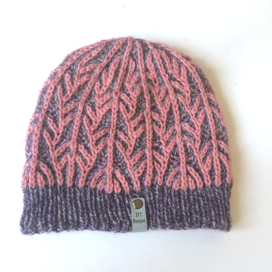 Hand knitted beanie hat in purple & pink