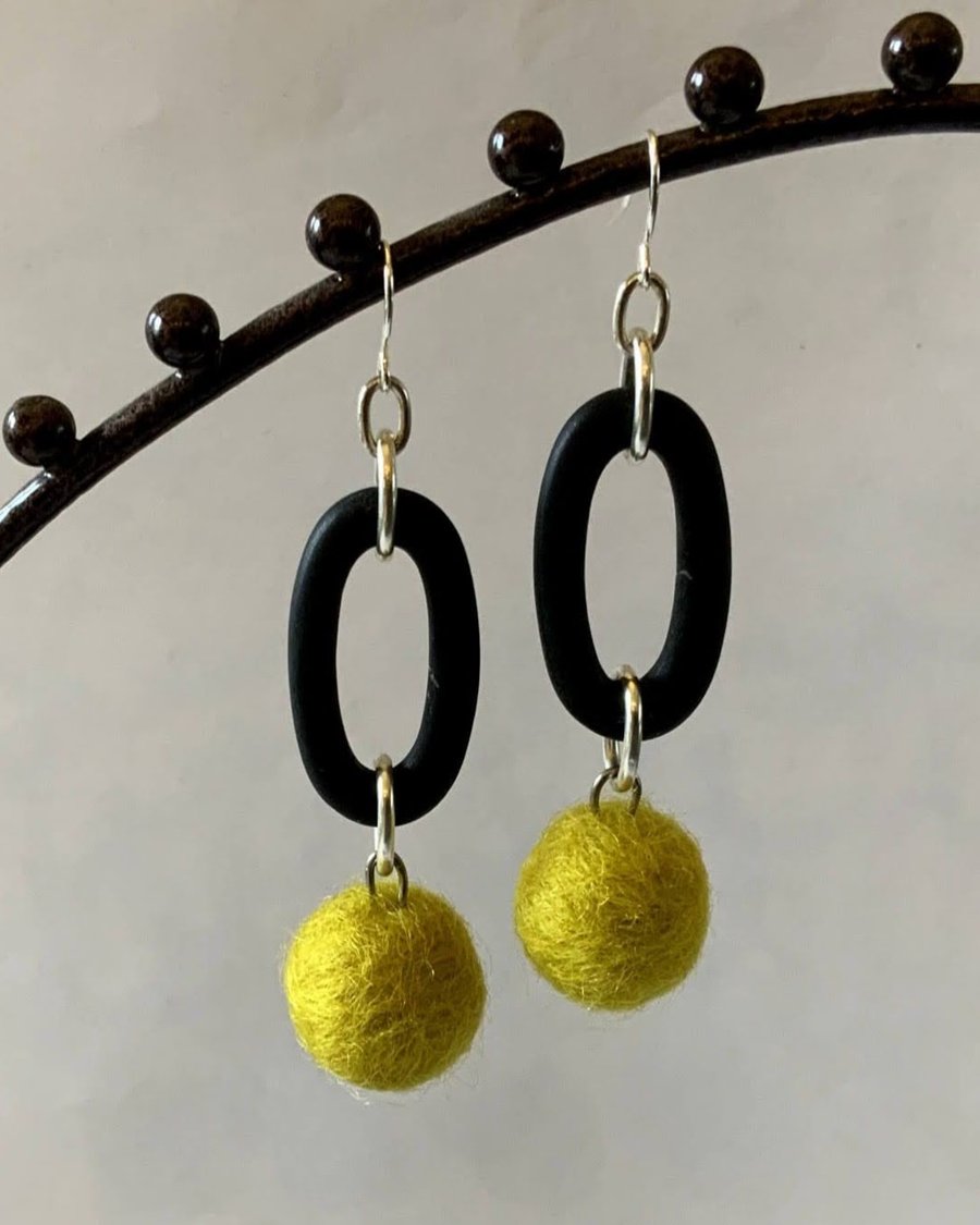 Contemporary felt wool ball and rubber earrings