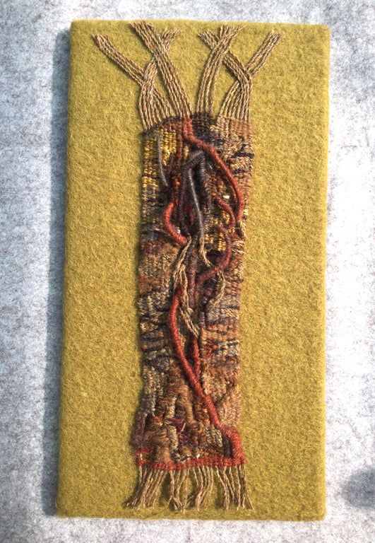 Mounted handwoven tapestry weaving,  textile art in browns, grey  and red