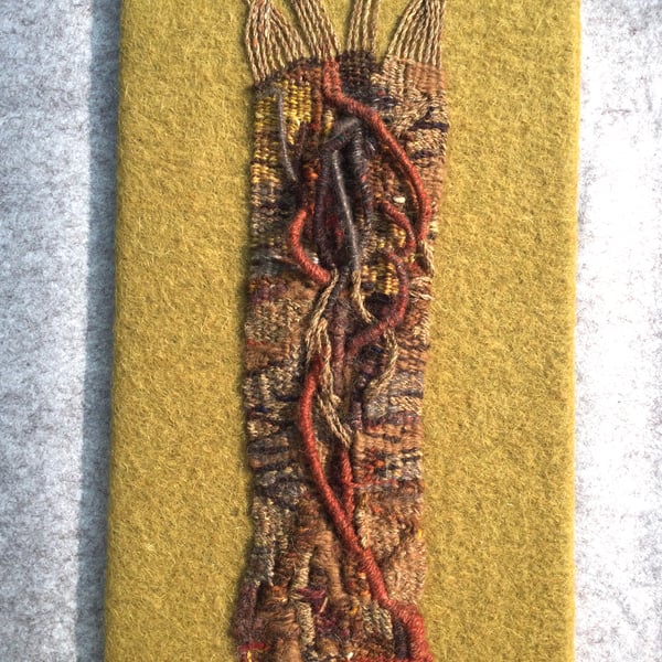 Mounted handwoven tapestry weaving,  textile art in browns, grey  and red