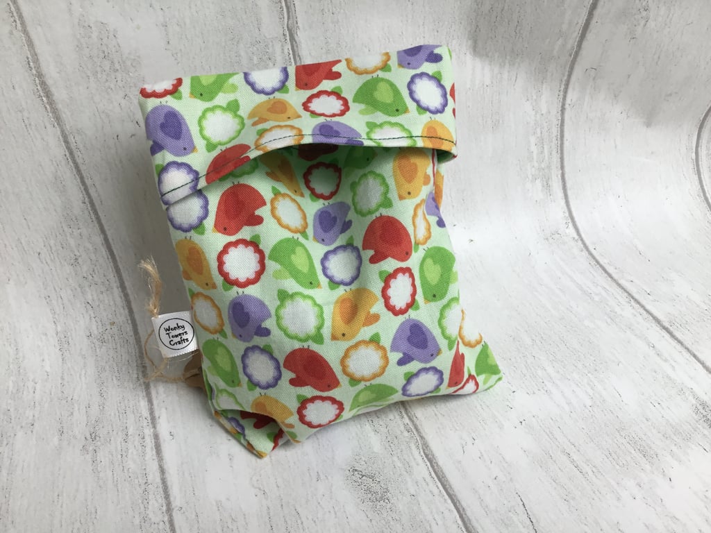 Large reusable snack bag with food-safe lining. Green birds