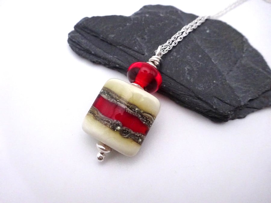 lampwork glass pendant necklace, red and ivory pillow