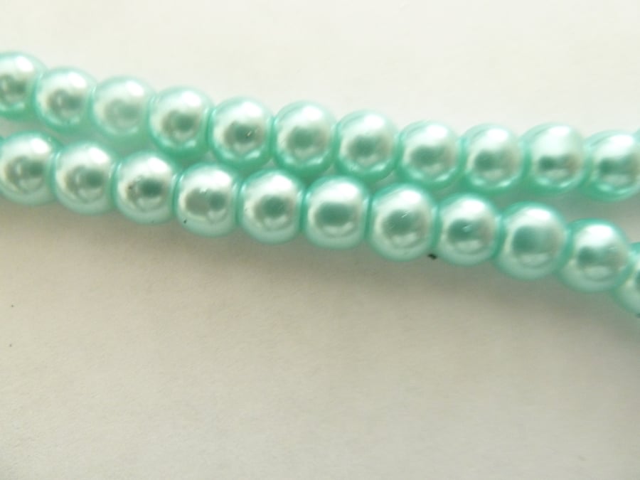 100 turquoise glass pearls