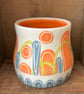 Ceramic hand thrown pot with unique orange and blue decoration - Image 3