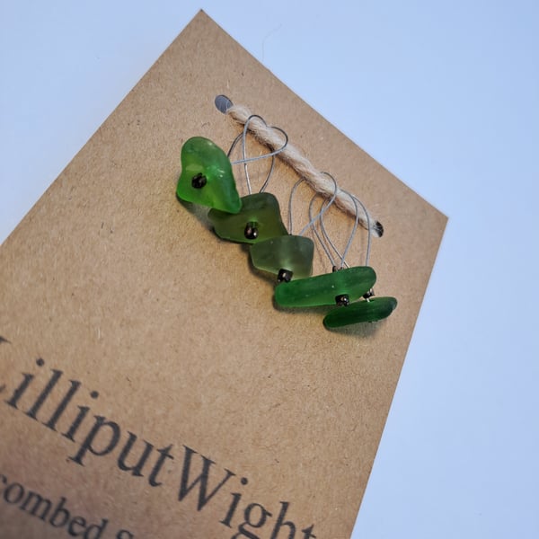 Five green sea glass stitch markers