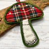 Embroidered up-cycled red plaid mushroom home decoration. 