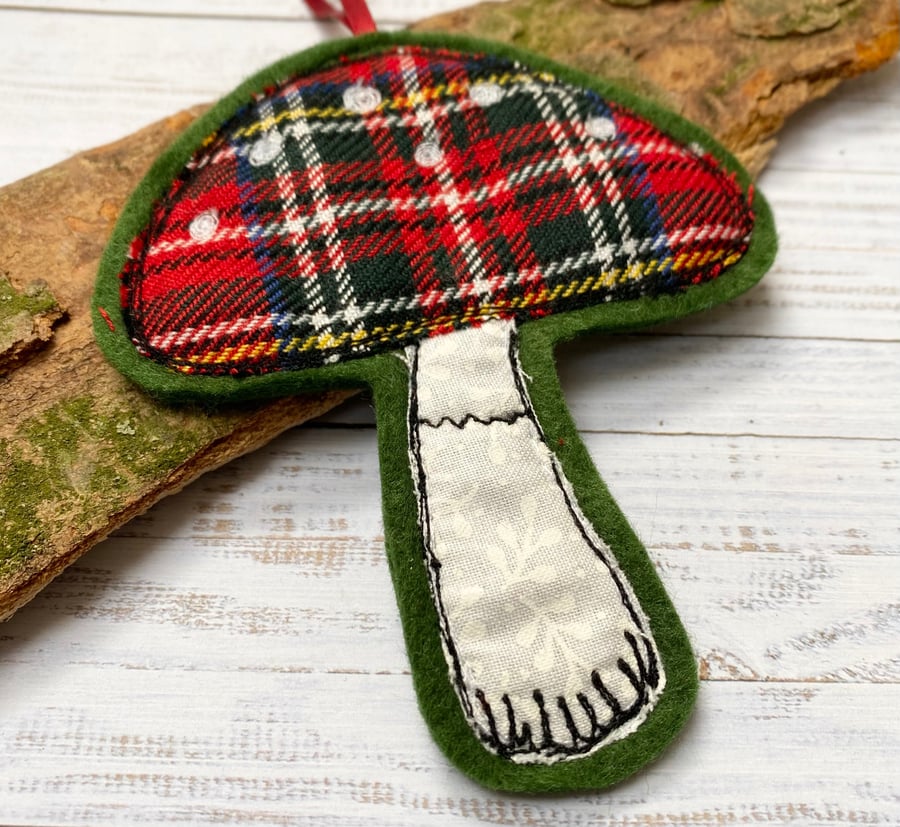Embroidered up-cycled red plaid mushroom home decoration. 