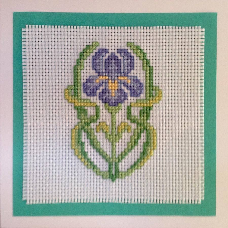 Handmade cross stitch greetings card of an iris art nouveaux style