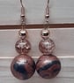 Conker brown and black dangly earrings with a bronze sheen - Image 2