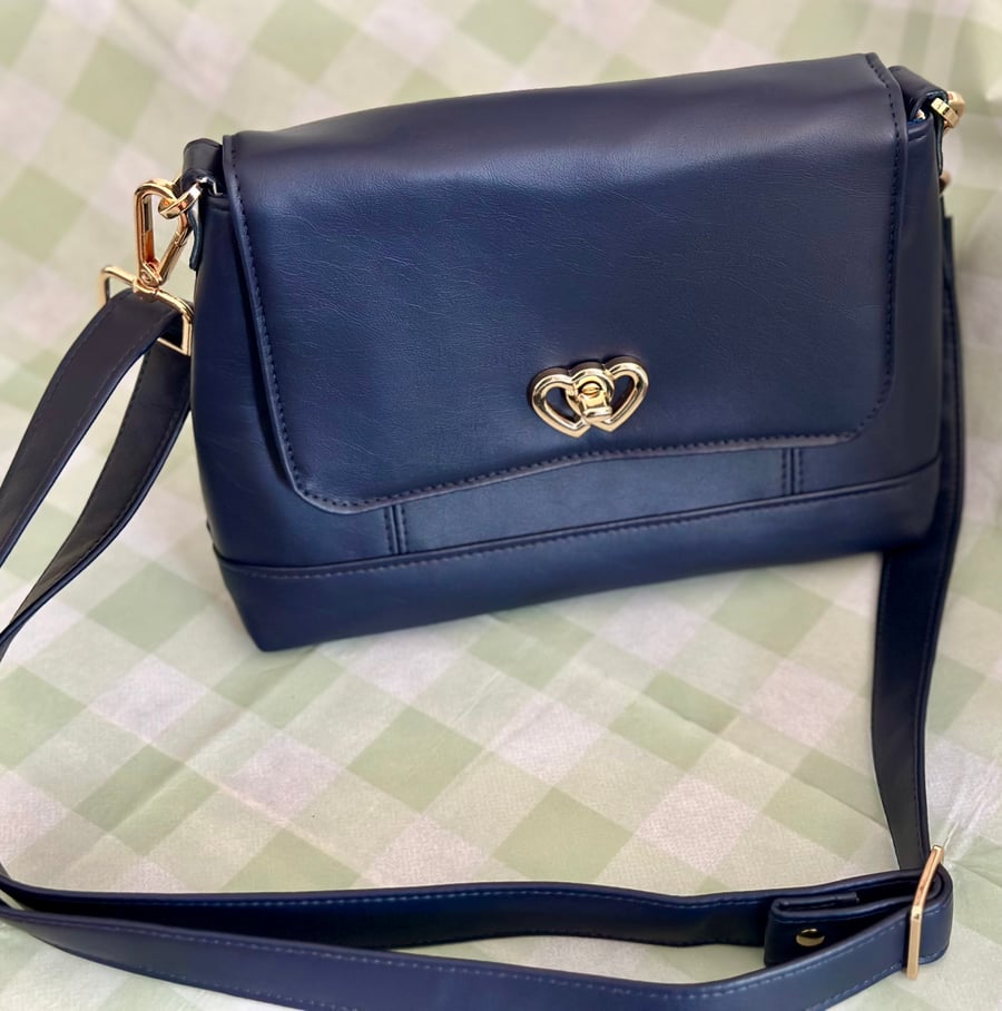 Mini Iris Crossbody Bag. Pattern by A Quaint Stitch.