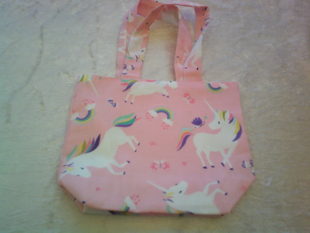 Unicorns and Rainbows on a Pale Pink Background Fabric Handbag