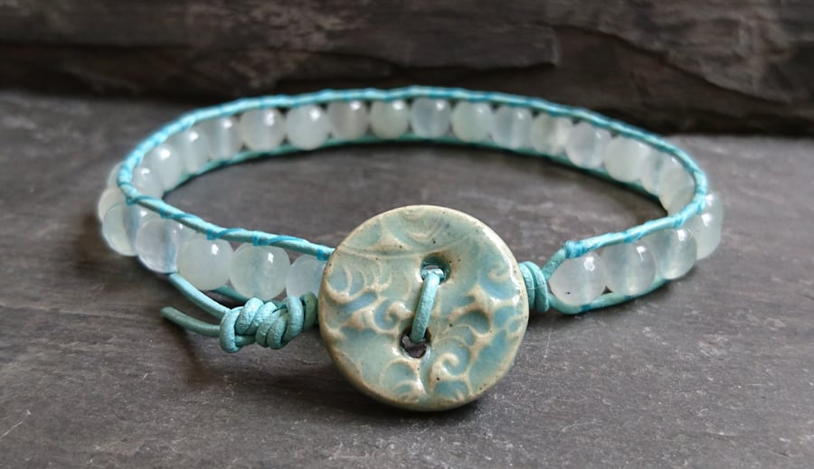 Aqua leather bracelet with faceted glass beads and ceramic button