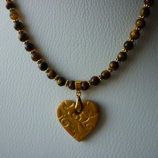 TIGERS EYE GEMSTONES AND GOLD HEAT NECKLACE.  814