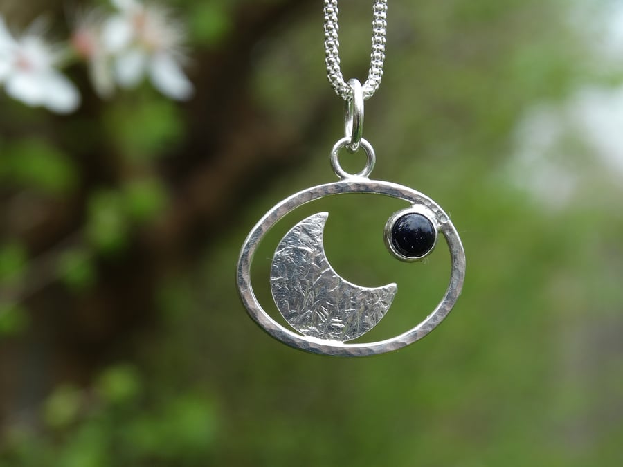 Textured crescent moon pebble pendant in Eco Silver with blue goldstone