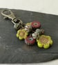 Red, green and antique gold bag charm with Czech glass beads and flowers - Image 1