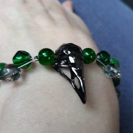 Gothic Bird skull charm bracelet with green beads. Gift boxed. 