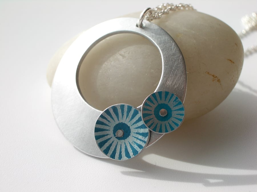 Circle pendant necklace in brushed aluminium with teal and turquoise discs