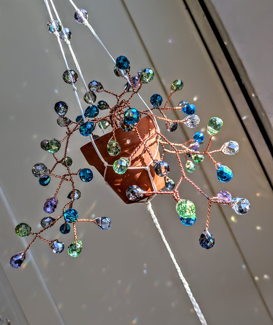 Suncatcher ("sea spray") copper wire and glass beads hanging plant 
