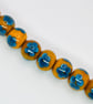 Handmade teal and mustard daisy patterned lamp work glass beads - Image 3