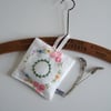 Lavender bag, with circular vintage floral embroidery.