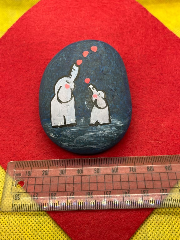 Hand painted pebble with hearts and elephants