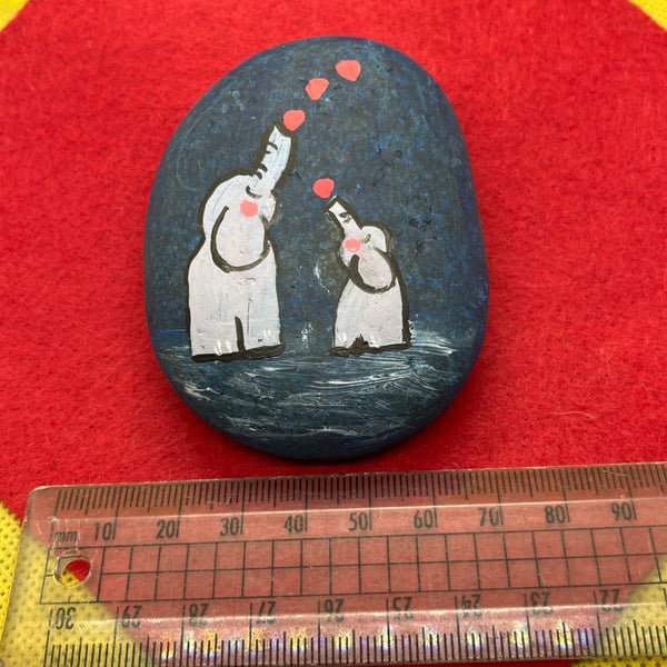 Hand painted pebble with hearts and elephants