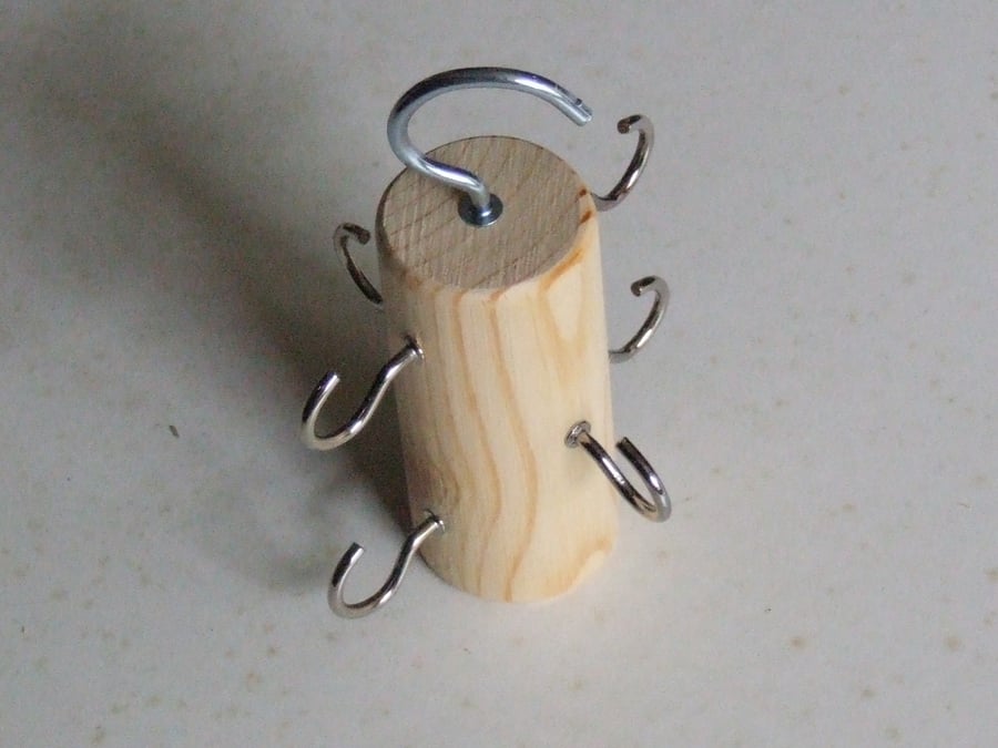 Belt holder or hanger for hanging belts in a bedroom wardrobe, ideal space saver