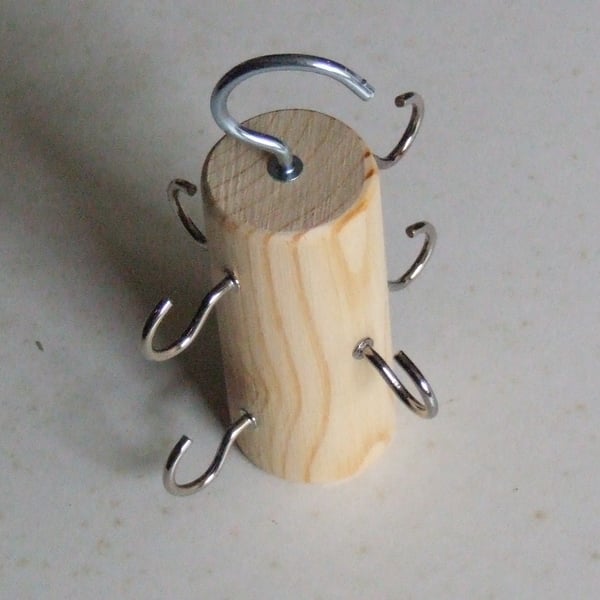 Belt holder or hanger for hanging belts in a bedroom wardrobe, ideal space saver