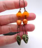 orange and green leaf ceramic earrings - Image 4