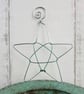 Silver Wire Star Decoration with a Green Centre