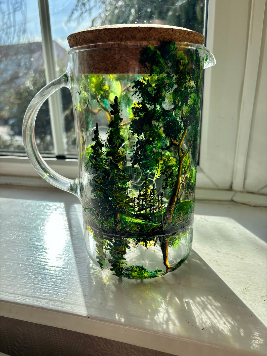 A glass hand painted and fired pitcher with lid by Andrew Jenkins 
