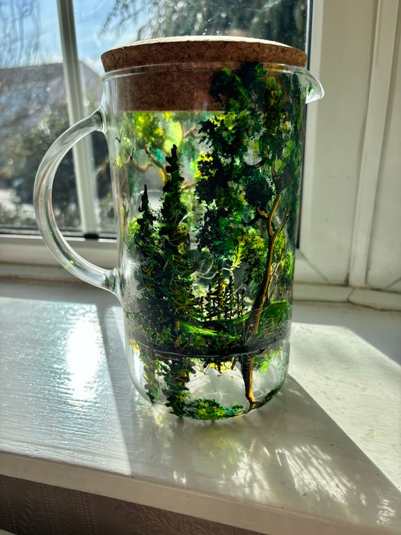 A glass hand painted and fired pitcher with lid by Andrew Jenkins 