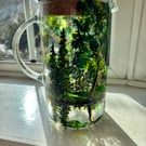 A glass hand painted and fired pitcher with lid by Andrew Jenkins 