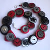 Red, black, grey, silvery button necklace