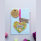 'Hugs' hanging heart decoration with plantable wildflower seed card