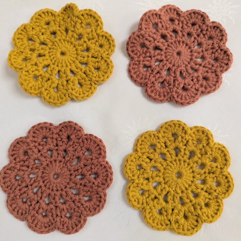 Set of 4 crochet coasters in terracotta and gold