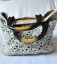 Crocheted lined bag with solid handles