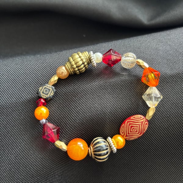 Handmade orange, yellow & gold 16cm bracelet. Would make a lovely gift. 