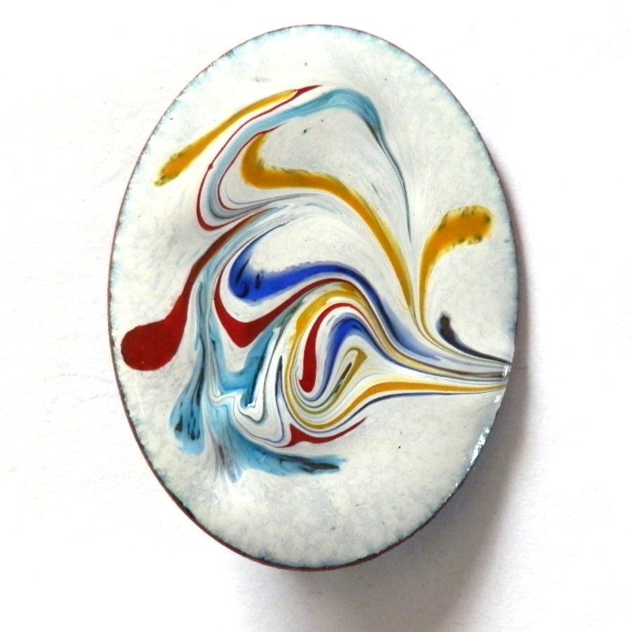 red, turquoise,blue and yellow scrollwork on white - large brooch
