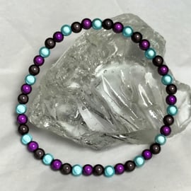 AL130a Purple, turquoise and black miracle bead anklet