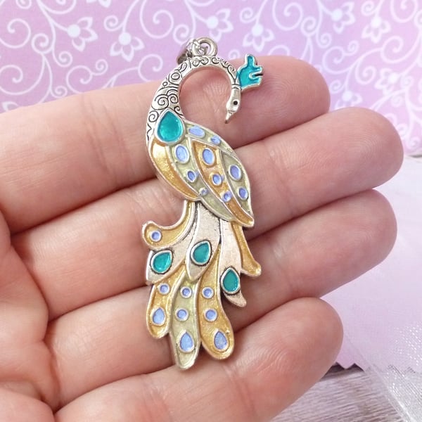Golden peacock pendant with teal and lilac accents
