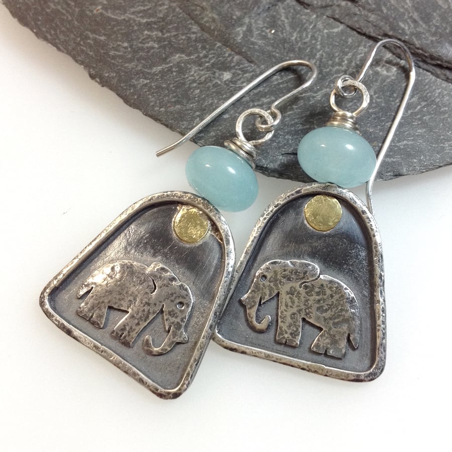 Silver elephant earrings with aquamarine.