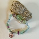 Pisces March birthday charm bracelet featuring aquamarine beads
