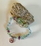 Pisces March birthday charm bracelet featuring aquamarine beads