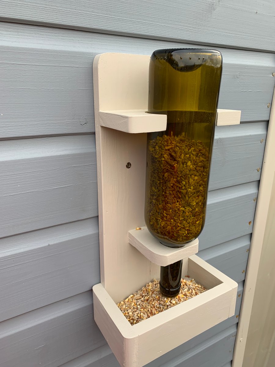 Handmade recycled bottle bird feeder