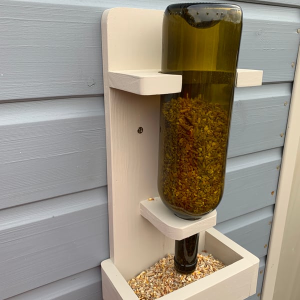 Handmade recycled bottle bird feeder