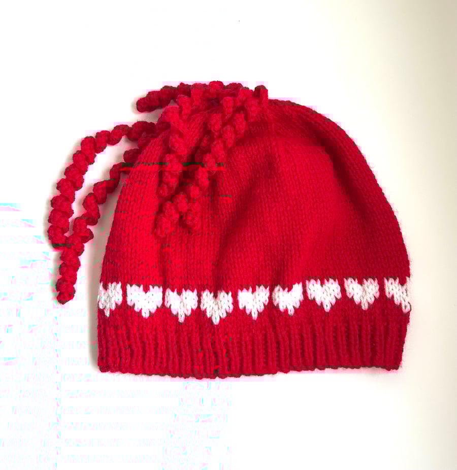 ‘Love is in the hair!’ Hand knitted beanie with hearts 