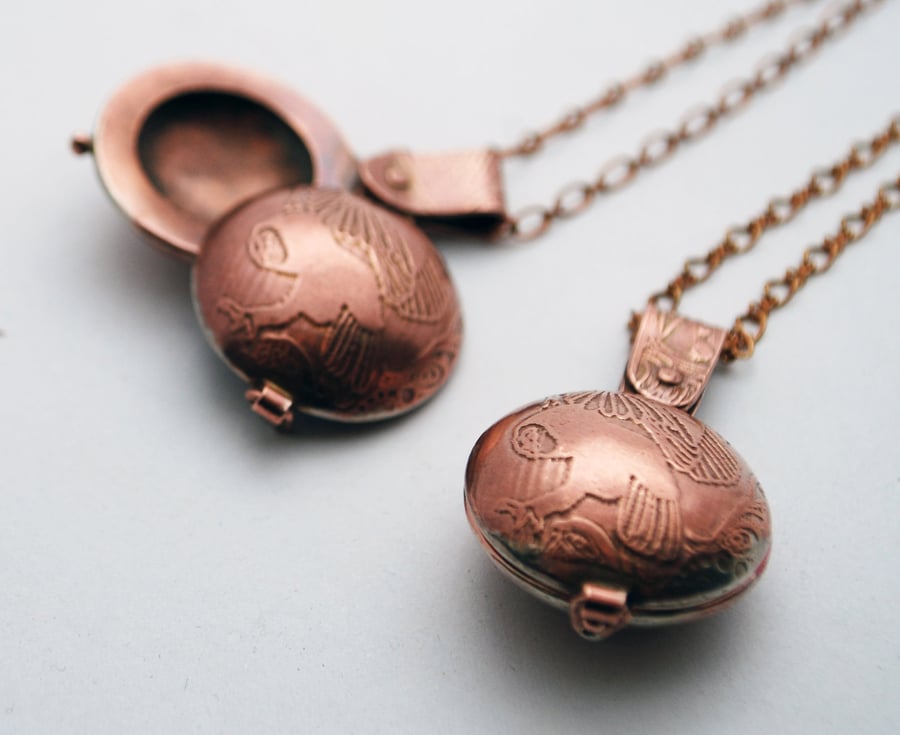 copper swivel owl locket