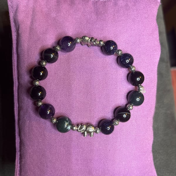 Handmade bracelet, 16cm. Purple, green & black with elephant charm. 