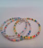 Set of 3 Stacking Memory Wire Cuff Bracelets with a Silver Plated Angel Charm - Image 1